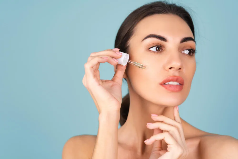 close-beauty-portrait-topless-woman-with-perfect-skin-natural-make-up-holds-serum-youth-skin-hydration-dropper-with-cosmetic-oil
